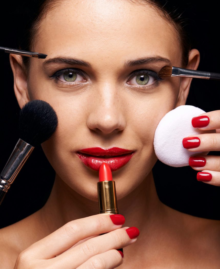 A beautiful young woman having various make up techniques tried on her face